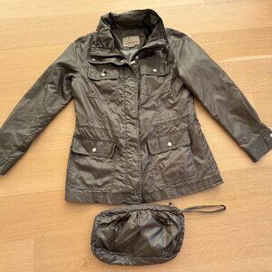 Rainforest Rain Jacket with accompanying zipper bag.